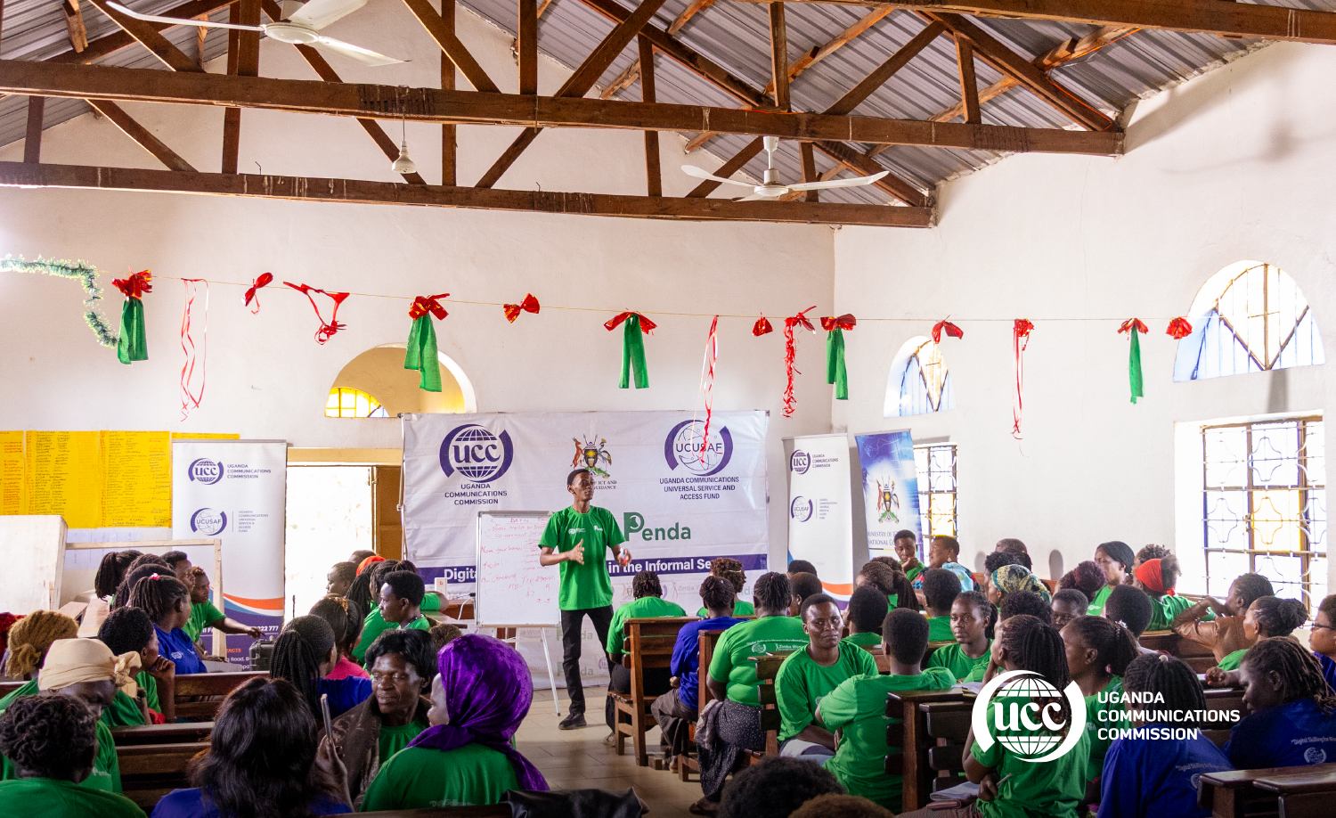 Full community hall training session for UCC, Ministry of ICT, and UCUSAF—documented by Stratco for implementing client Penda across 50+ districts.