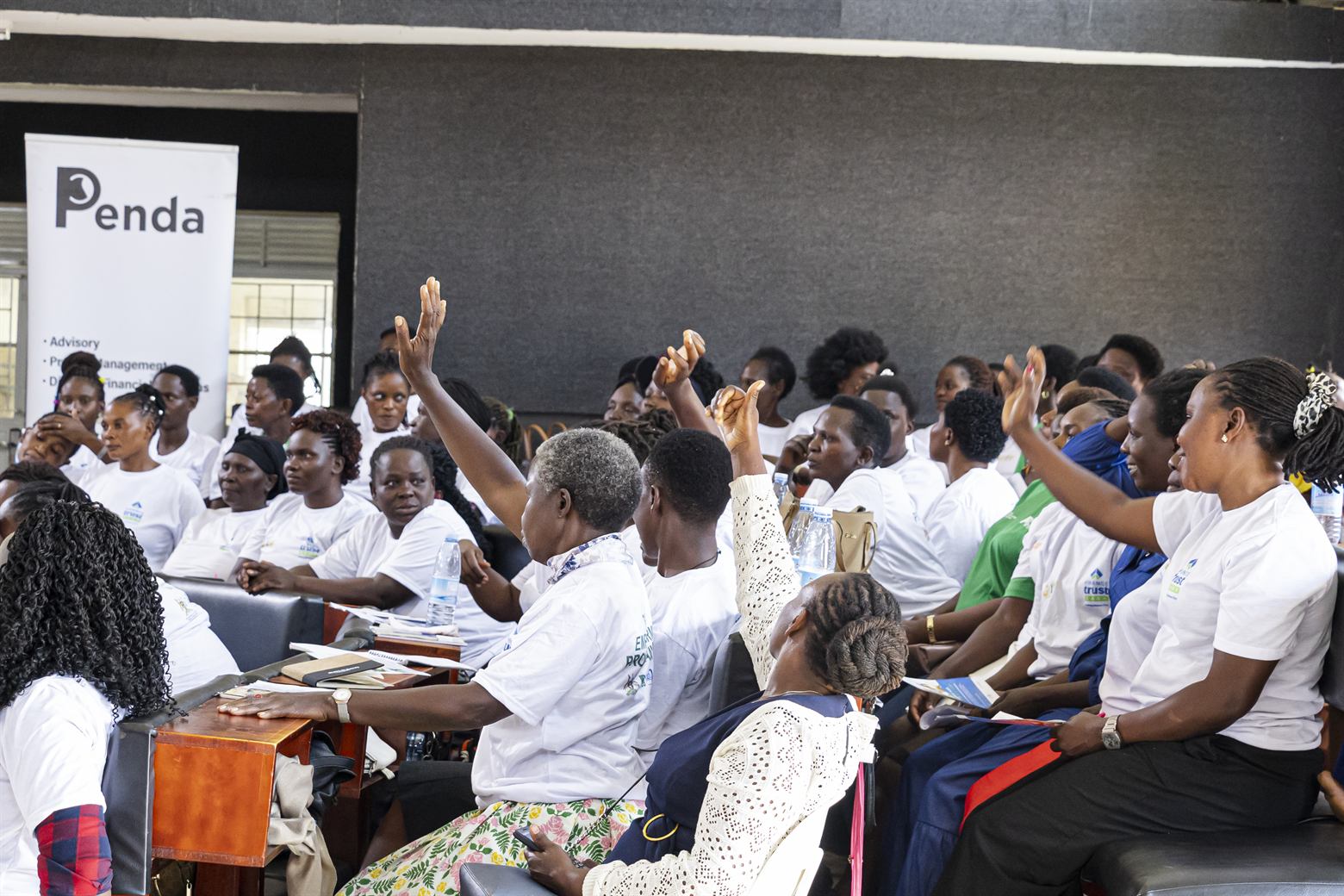 Participants raising hands during an expert-led Q&A—captured for same-session digital coverage and documentary storytelling.